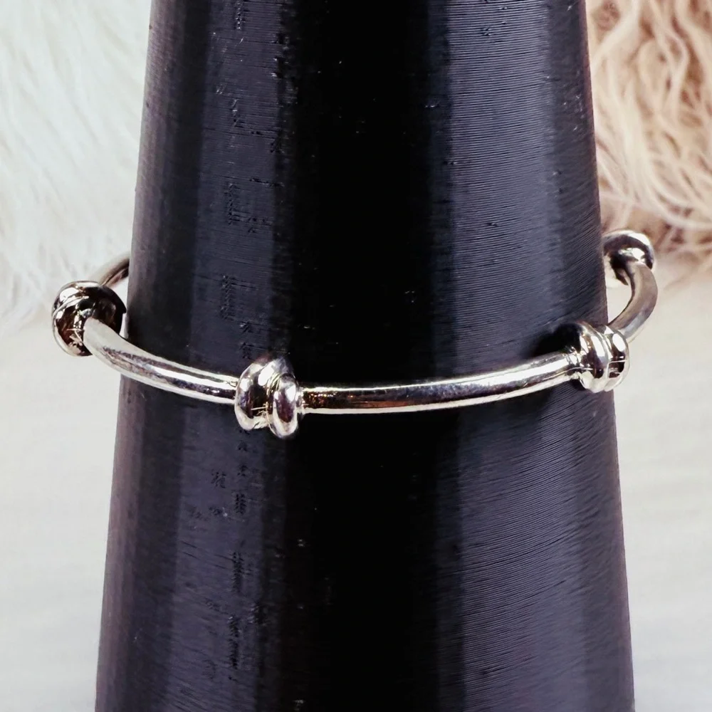 Pretty Silvertone weighted knotted bangle stacking bracelet
